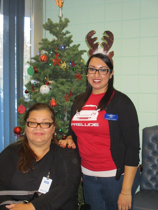 Brenda posing with a student